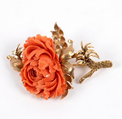 Lot 25 - A coral brooch of flower form, set in an...