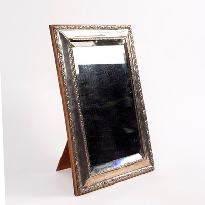 Lot 38 - A silver framed mirror with easel back marks...