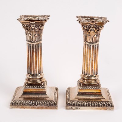 Lot 42 - A pair of silver dwarf candlesticks of...