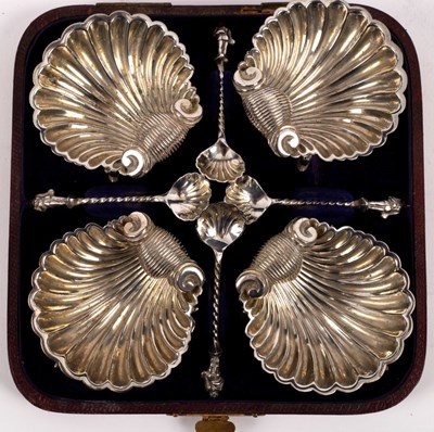 Lot 89 - A set of four plated shell-shaped salts and...