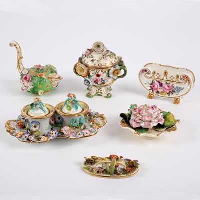 Lot 111 - A group of flower encrusted English porcelain,...