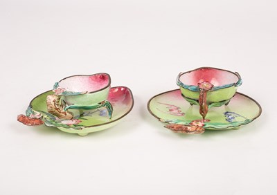 Lot 42 - A near pair of Cantonese enamel cups and saucers