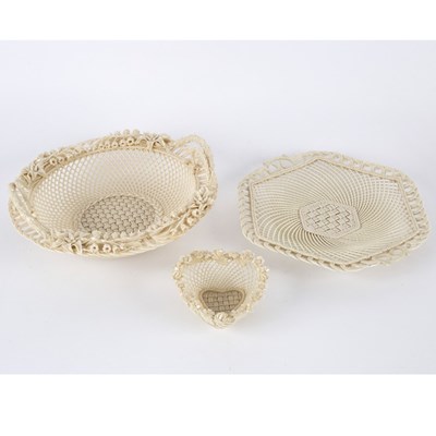 Lot 134 - A Belleek circular two-handled basket, another...