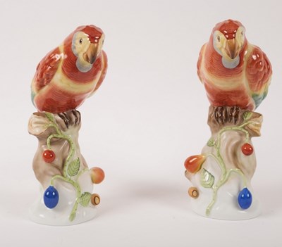 Lot 206 - A pair of Herend models of red parrots perched...