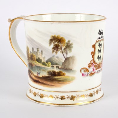 Lot 255 - An English porcelain armorial mug, circa 1800,...