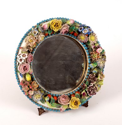 Lot 285 - A late 19th Century Dresden circular mirror,...