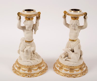 Lot 292 - A pair of glazed and biscuit porcelain figural...