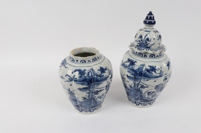 Lot 309 - A pair of Dutch Delft jars, one with cover,...