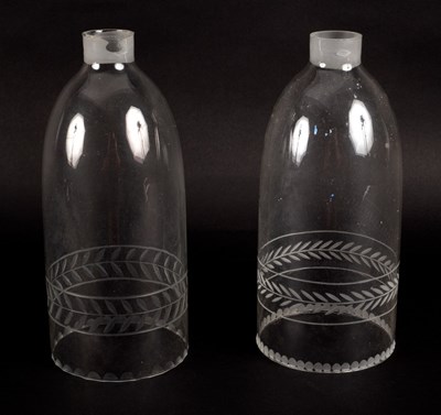 Lot 326 - A pair of glass lantern chimneys with engraved...