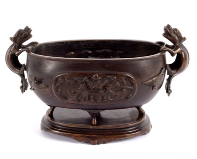 Lot 367 - A Chinese oval censer with grotesque handles...