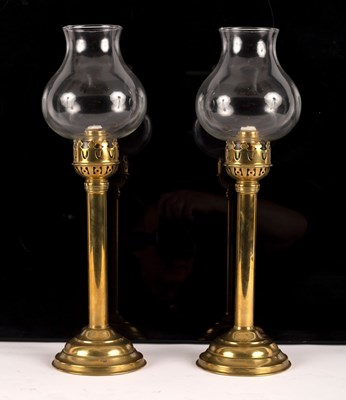 Lot 436 - A pair of brass spring loaded candlesticks of...