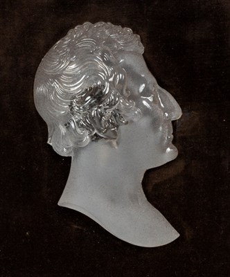 Lot 446 - A Classical relief bust in glass, framed and...