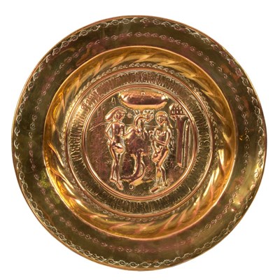 Lot 450 - A Nuremberg brass alms dish, the centre...