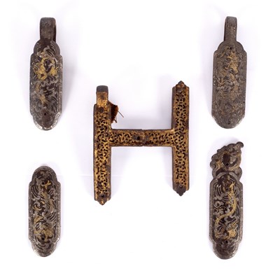 Lot 474 - Four shaped oval Tibetan bridle mounts with...