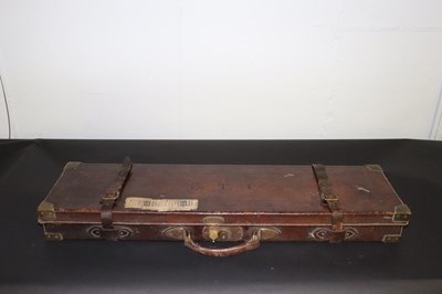 Lot 483 - A fitted leather gun case with some cleaning...