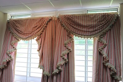 Lot 509 - A pair of pink, moire stripe curtains, 224cm x...