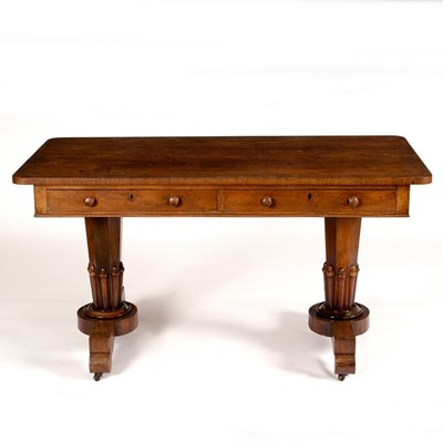 Lot 557 - A William IV rosewood writing table with two...