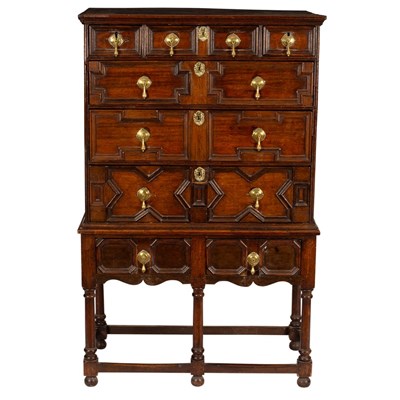 Lot 558 - An 18th Century oak chest of three long and...