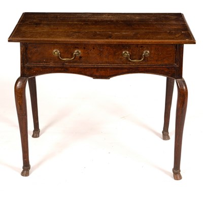 Lot 560 - An 18th Century oak table, fitted one drawer...