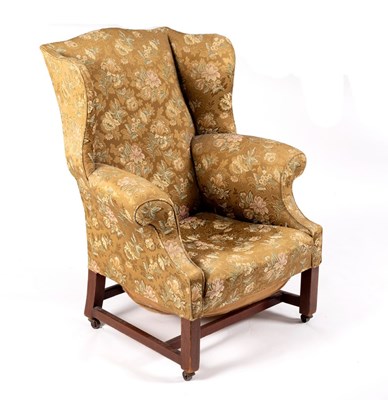 Lot 564 - A George III style wingback armchair