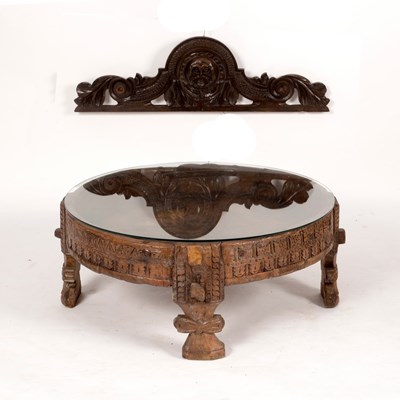 Lot 602 - An Indian circular carved drum-top table on...