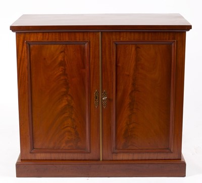 Lot 609 - A mahogany cupboard enclosed by a pair of...