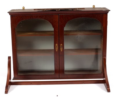 Lot 612 - A small mahogany hanging cupboard, enclosed by...