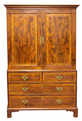 Lot 615 - A George III mahogany linen press fitted for...