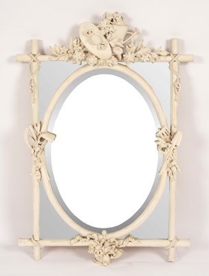 Lot 649 - A white painted segmented mirror, the crest...