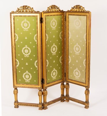 Lot 653 - A gilt wood three-panel, two-fold screen on...