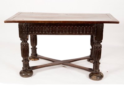 Lot 669 - A 17th Century oak table, the two plank top...