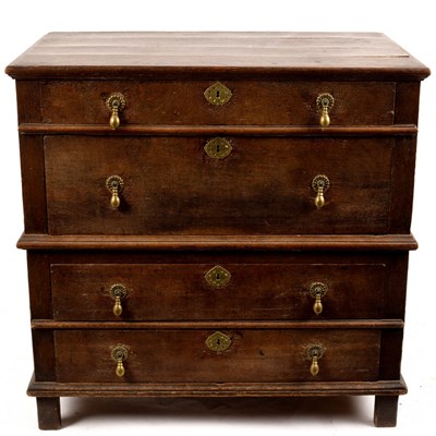 Lot 674 - A Jacobean oak chest of four long drawers with...