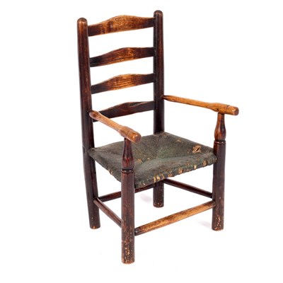 Lot 676 - A child's ladder back chair with rush seat and...