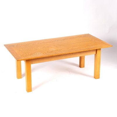 Lot 678 - A bleached oak coffee table on square ash legs,...