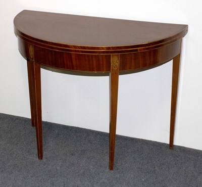 Lot 687 - A George III mahogany tea table, the D-shaped...