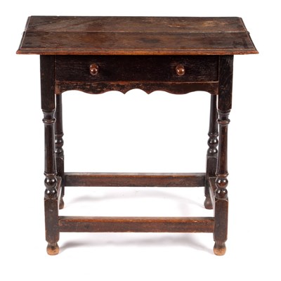 Lot 689 - An 18th Century oak side table, the planked...