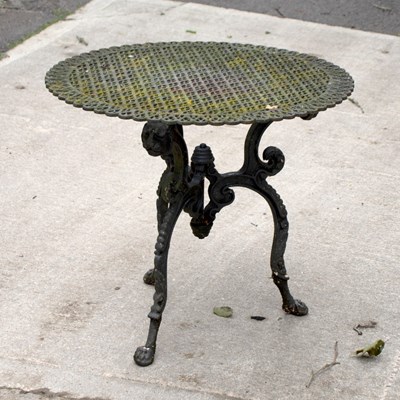 Lot 715 - A pierced cast iron garden tabletop on an...