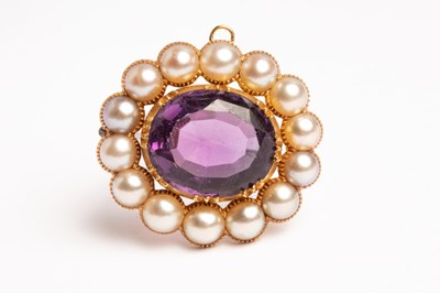 Lot 10 - A 19th Century amethyst and pearl oval brooch,...
