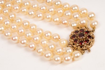 Lot 43 - A three-row cultured pearl choker necklace,...