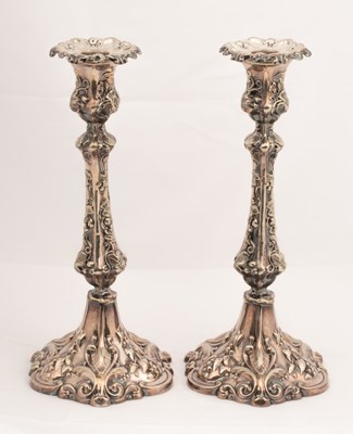 Lot 86 - A pair of silver plated candlesticks, R&J...