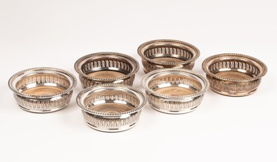 Lot 87 - A set of six silver plated wine coasters,...