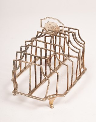 Lot 120 - A George III silver toast rack, makers mark HG,...