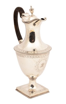 Lot 183 - A George III silver hot water jug, Charles...