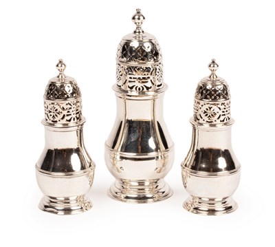 Lot 185 - A set of three Queen Anne silver casters,...