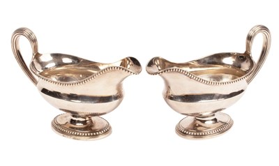 Lot 193 - A pair of George III silver sauce boats,...