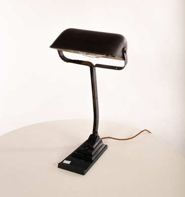 Lot 43 - A painted metal desk lamp with articulated...