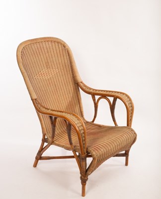 Lot 51 - A Dryad rattan chair with arched back and seat...