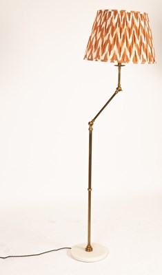 Lot 79 - A brass adjustable standard lamp of modern...