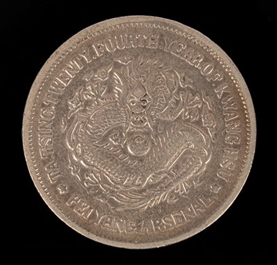 Lot 501 - A Chinese silver coin, one side with relief of...