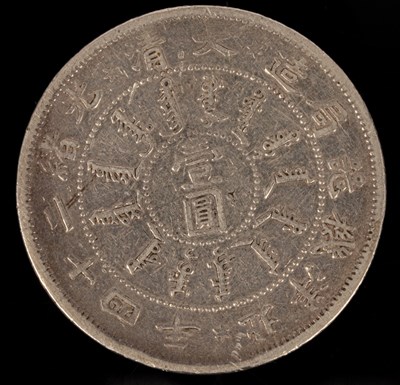 Lot 501 - A Chinese silver coin, one side with relief of...